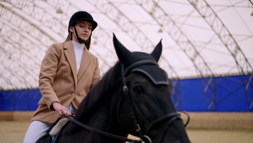 Pretty lady horse riding. Countryside ranch lifestyle.