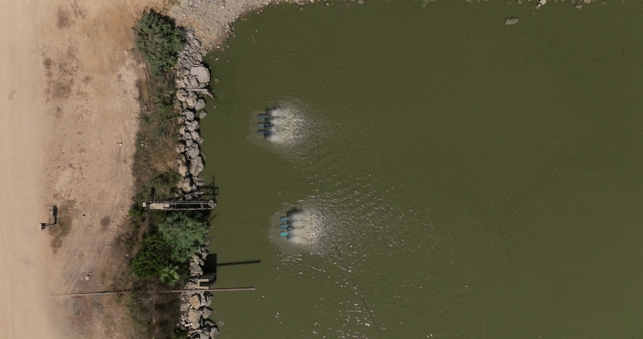Two Aerator oxidation units operating in a Fish farm. | Shutterstock HD Video #1094705461