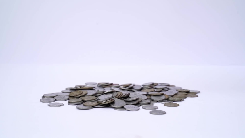 Pile of money (indian coin ) isolated on white background. Pile of Indian coins | Shutterstock HD Video #1094707333