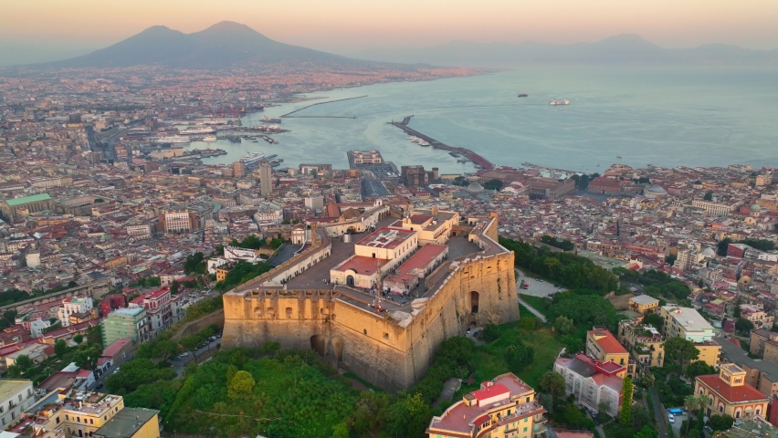 flying above Naples at sunset, aerial view of Italian city of Naples and gulf of Naples, vacations in southern Italy, famous European tourist destination. High quality 4k footage Royalty-Free Stock Footage #1094707659