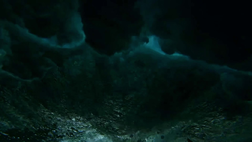 Powerful wave breaks underwater turbulence, wave crashing on the corral reef in tropical ocean. spinning vortex. powerful nature, strong wave, danger of drowning. slow motion. Royalty-Free Stock Footage #1094708091