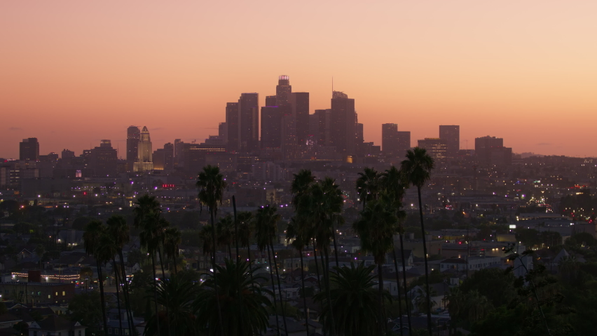 Sunset scene. City landscape. Business city. Business travel. Colorful sunset. Colored sky. Dusk skyline. Sunset city skyline 4K. Cityscape skyline. Epic view of sunset skyline Los Angeles city USA