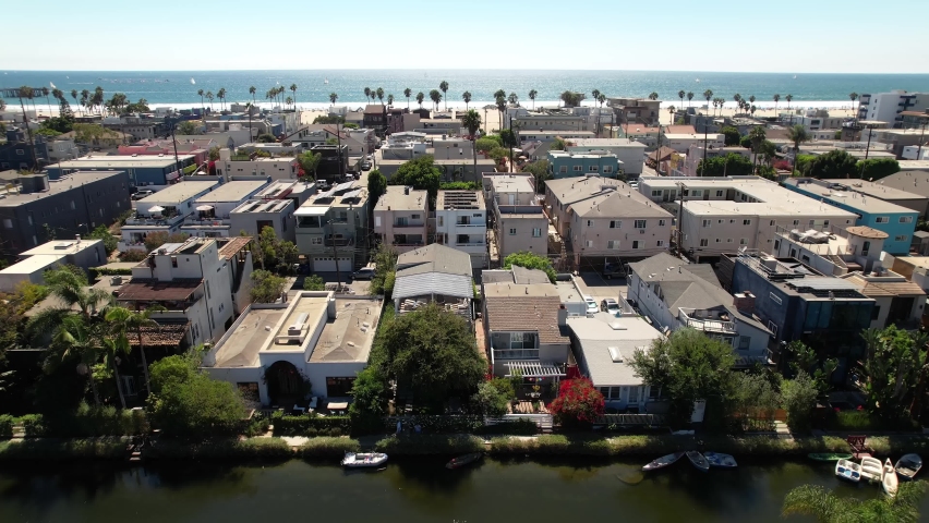 Aerial upwards over Residential neighorhood oceanfront in Venice Beach, California