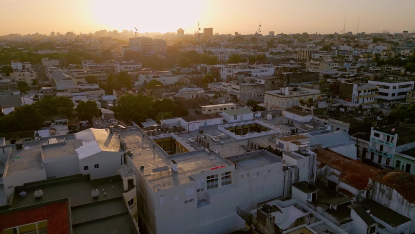 Drone flying over Colonial zone at sunset, Santo Domingo city in Dominican Republic. Aerial forward Royalty-Free Stock Footage #1094725027