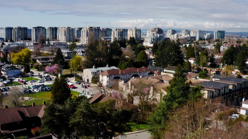 Cars Driving In The Streets Of Community In Richmond City Near The High-rise Buildings In BC, Canada. - aerial