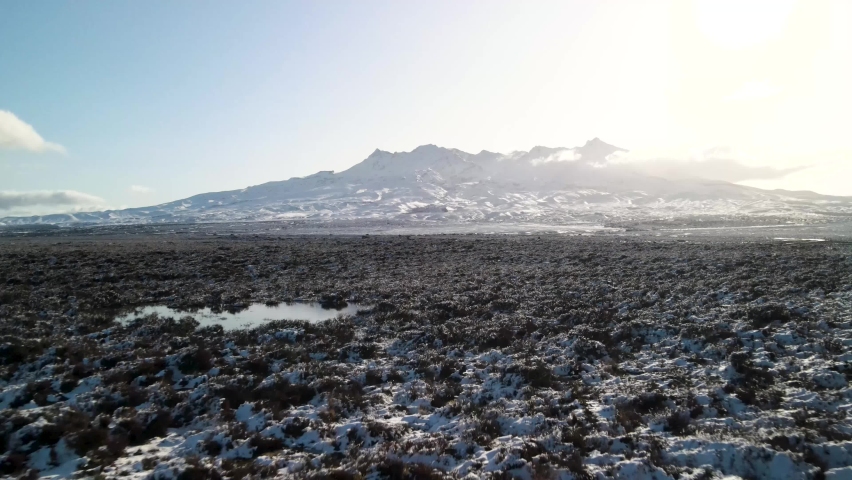 Beautiful aerial of Mount Ruapehu volcano, snow capped peak during winter in New Zealand