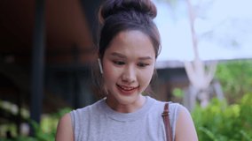 Smart casual asian businesswoman startup company entrepreneur small business owner work and discussion video conference with client at garden balcony exterior background Attractive cheerful female use