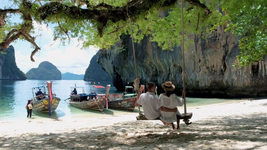 Koh Hong Island Krabi Thailand, a couple of men and women on the beach of Koh Hong, a tropical white beach with Asian women and European men in Krabi Thailand | Shutterstock HD Video #1094734505