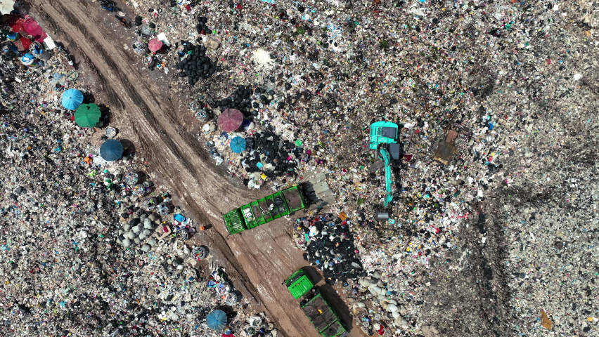 Time lapse of Garbage trucks unload garbage over the landfill. Pollution concept. | Shutterstock HD Video #1094739649