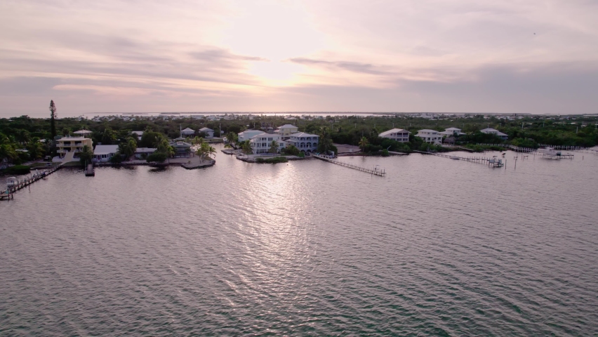 Sunset Aerial View Of Coastal Real Estate In Florida Keys, Florida, USA. drone shot