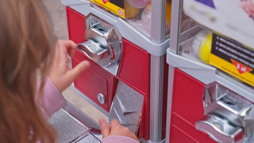 Caucasian Kid Buying Random Toy from Capsule Toy Vending Machine at Amusment Park or Festival Top View
