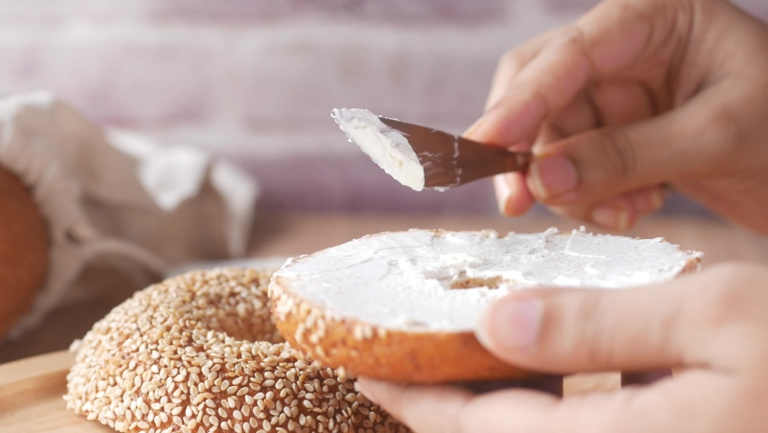 cheese cream spread on fresh bagel bread 