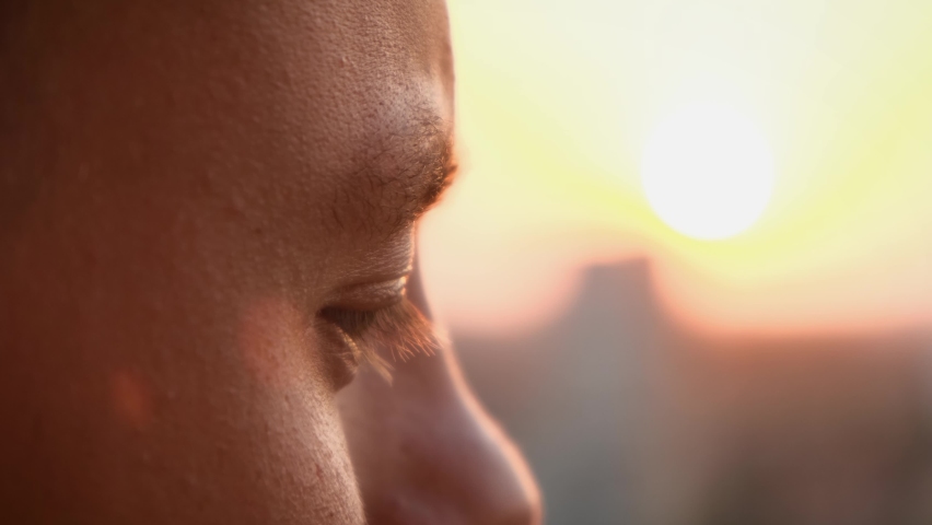 Observant concentrated male eye at sunset, close-up | Shutterstock HD Video #1094760243