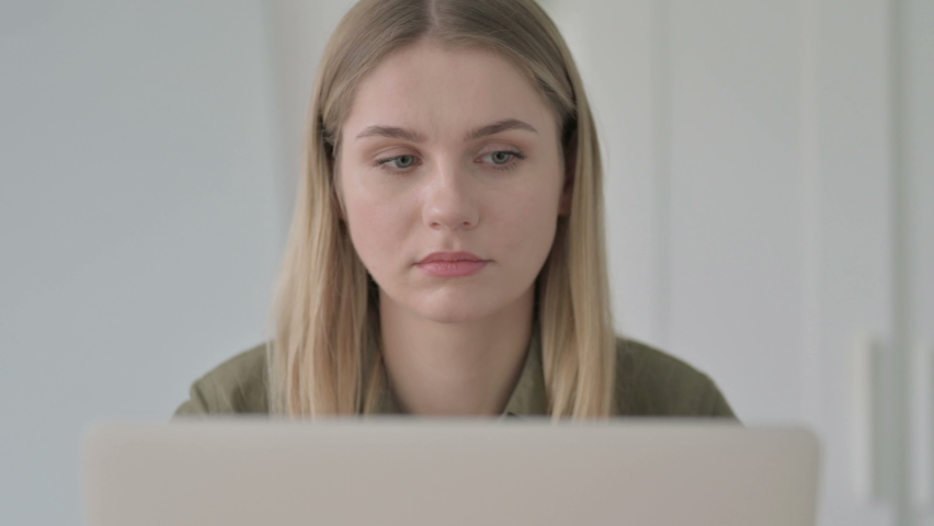 Close Up of Young Blonde Woman Using Laptop