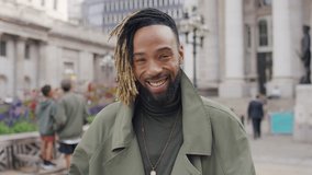 Portrait of handsome and stylish young man smiling to camera, in slow motion - Powered by Shutterstock - Get 15% off with code: PIKWIZARD15
