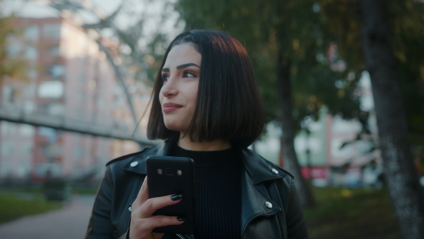 Modern Technology Using Phone Face Recognition Biometrics Portrait. High Tech 3D Detection of Person Face ID and Young beautiful Female Waving. - Powered by Shutterstock - Get 15% off with code: PIKWIZARD15