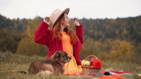 Redhead woman in red and autumn Thanksgiving still life with plaid, pumpkins and apples. A girl in orange rests in nature with a dog. Autumn weekend idea, bachelorette party, date night, harvest day. - Powered by Shutterstock - Get 15% off with code: PIKWIZARD15