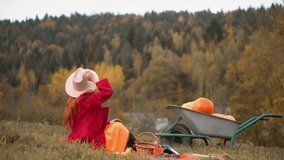 Redhead woman in red and autumn Thanksgiving still life with plaid, pumpkins and apples. A girl in orange rests in nature with a dog. Autumn weekend idea, bachelorette party, date night, harvest day. - Powered by Shutterstock - Get 15% off with code: PIKWIZARD15