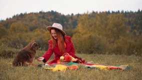 Redhead woman in red and autumn Thanksgiving still life with plaid, pumpkins and apples. A girl in orange rests in nature with a dog. Autumn weekend idea, bachelorette party, date night, harvest day. - Powered by Shutterstock - Get 15% off with code: PIKWIZARD15