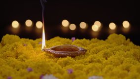 Clay diya lamps lit during diwali celebration. - Powered by Shutterstock - Get 15% off with code: PIKWIZARD15