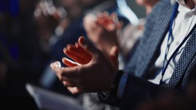 Close Up on Hands of a Crowd of People Clapping in Dark Conference Hall During a Motivational Keynote Presentation. Business Technology Summit Auditorium Room Full of Delegates. - Powered by Shutterstock - Get 15% off with code: PIKWIZARD15