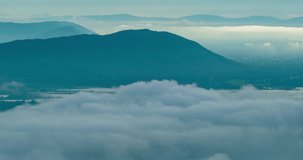 Sea of fog landscape time lapse video Amazing in nature Sea of fog texture over landscape mountain background 4K DCI 4096x2160P