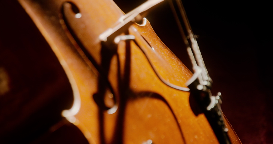 Cello leaning against church pews in the sunlight | Shutterstock HD Video #1094798119