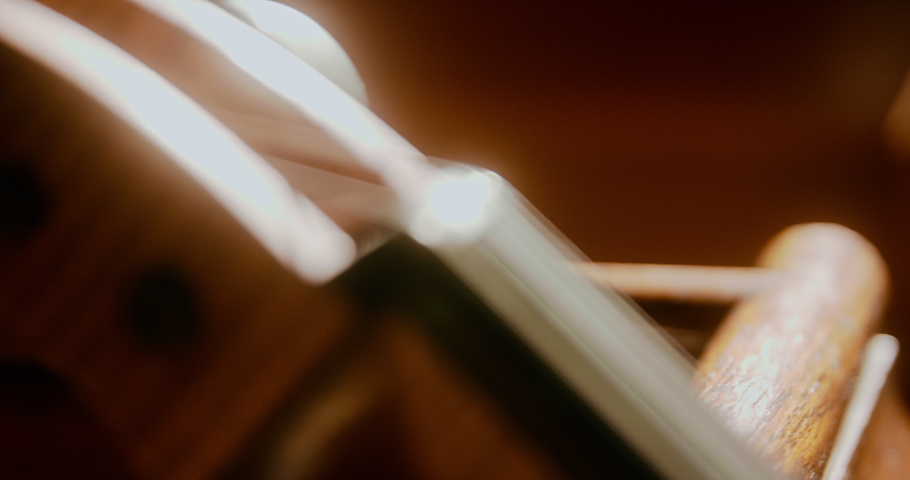 Cello leaning against church pews in the sunlight | Shutterstock HD Video #1094798125