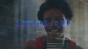 Animation of level up text and data processing african american man smiling. Global sport, computing and digital interface concept digitally generated video. - Powered by Shutterstock - Get 15% off with code: PIKWIZARD15