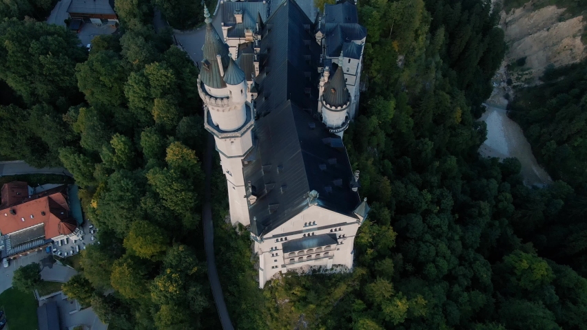 Aerial top down view of Neuschwanstein Castle Bavaria Germany Fairytale Castle Sunset View Fall Season Royalty-Free Stock Footage #1094801423