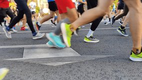 marathon participants run on asphalt early in the morning 4k video