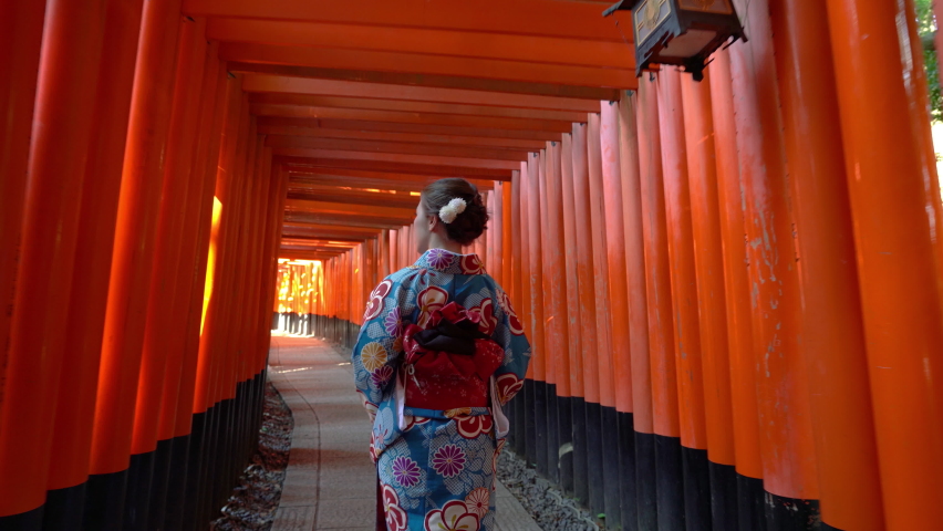 Asian women in traditional japanese kimonos visiting at Fushimi Inari Shrine in Kyoto, Japan. | Shutterstock HD Video #1094807175