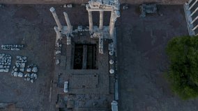 Aerial footage of an ancient city, top view of pergamon old city on hill with sunset light and colors