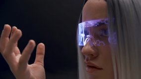 Thoughtful user examining checking VR technologies closeup. Blonde woman headset exploring metaverse, touching considering virtual reality subjects slow motion. Digital modern high-tech world concept  - Powered by Shutterstock - Get 15% off with code: PIKWIZARD15