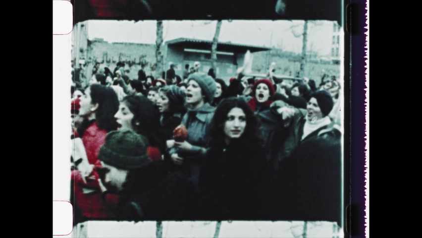 1979 Tehran, Iran. Massive protests erupt on International Women's Day as Iranian women refuse to veil themselves with a headscarf or hijab. 4K Overscan of Vintage Archival Newsreel Film