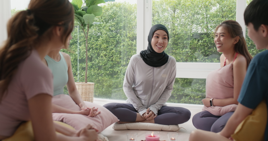 Gen Z asia people islam yoga coach girl in mental health care rehab center class fun laugh smile sit circle relax at workout club studio. Stress relief group talk young adult unity team life balance. Royalty-Free Stock Footage #1094826699