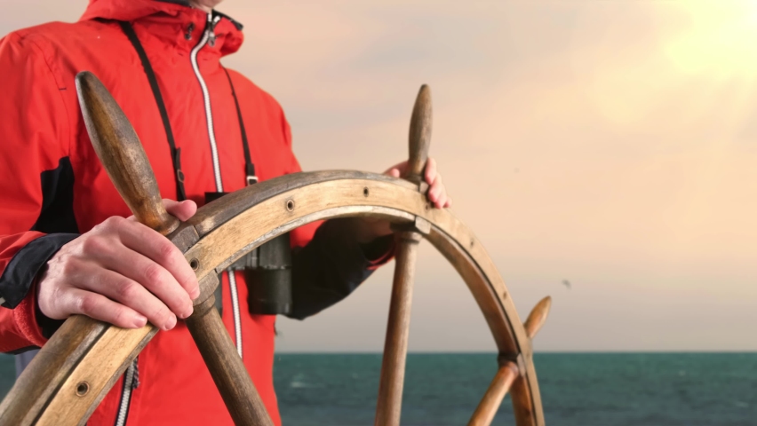 Captain Holding Hands on Ship Rudder and Looking in Binoculars For The Way Forward. Royalty-Free Stock Footage #1094828433