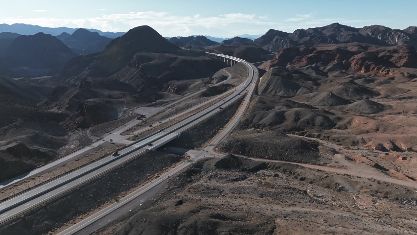 Famous sunny American desert highway road near Las Vegas on Arizona and Nevada border crossing. Beautiful desert roads and bridges.