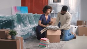 Tired unhappy married couple pack cardboard boxes, feel exhausted and unmotivated on moving day. Lender seize home due borrower stopped make payments, foreclosure, owner eviction concept.  - Powered by Shutterstock - Get 15% off with code: PIKWIZARD15
