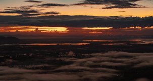 Sunrise and sea of fog video time-lapse. Nature video landscape view of green meadow and landscape on high angle view point a time lapse video in sunrise morning time. 4K DCI 4096x2160P