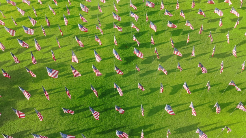 Aerial view of the ceremony commemorating lives lost in the September 11 terror attacks. A vast annual display of American and international flags for each citizen. High quality 4k footage | Shutterstock HD Video #1094852495