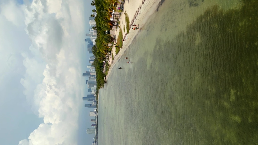 Aerial vertical drone video Miami Key Biscayne Beach approaching Downtown Miami