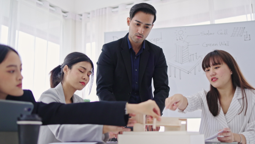 Group of Asian businessmen have a work presentation meeting. Brainstorming for the cooperation of company employees. Plan a successful marketing strategy project. | Shutterstock HD Video #1094852819