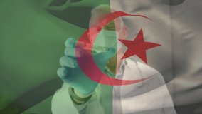 Animation of flag of algeria waving over doctor wearing face mask and holding vaccine. global medicine, healthcare services during covid 19 pandemic concept digitally generated video.