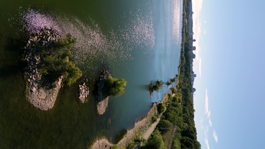 Aerial 4K vertical video of the coast of Burlington Bay with a view of Hamilton Ontario