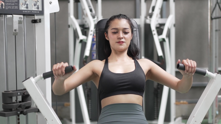 Healthy Asian athlete woman do workout exercise body weight lifting at fitness gym. | Shutterstock HD Video #1094883447