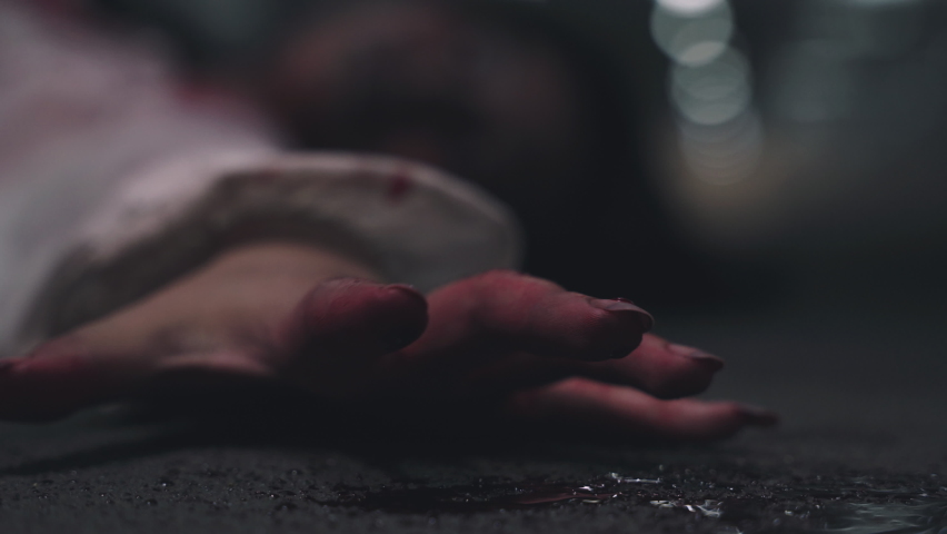 Closeup hand with blood of horror bloodthirsty ghost woman on floor, Homicide female hands jerky in blood with resentment torture and ask for help, murder and crime, Halloween horror day concept