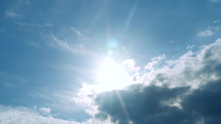 Bright Shining Sun Light Ray Sunbeam Flare Dark Cumulus Cloud and Cirrus Clouds on Beautiful Sunny Blue Sky in Summer Sunlight Sunray at Daylight Sunshine Day, 4k Time Lapse Royalty-Free Stock Footage #1094887867