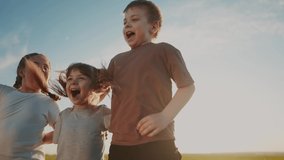 group of kids team hugging a jumping and rejoicing outdoors. happy family teamwork kid dream concept. family children lifestyle sisters brothers have fun hugging in the park in nature - Powered by Shutterstock - Get 15% off with code: PIKWIZARD15