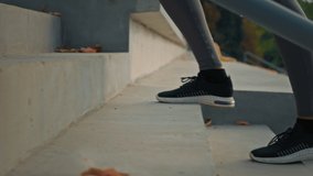 Active woman in sports sneakers climbing stairs on stadium area close up female athletic legs walking staircase cardio exercises training endurance slowly jog outdoors lifestyle activity for wellness - Powered by Shutterstock - Get 15% off with code: PIKWIZARD15